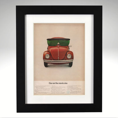 Framed poster of a VW Beetle Disney Movie Star Ad with sunglasses on a beige background