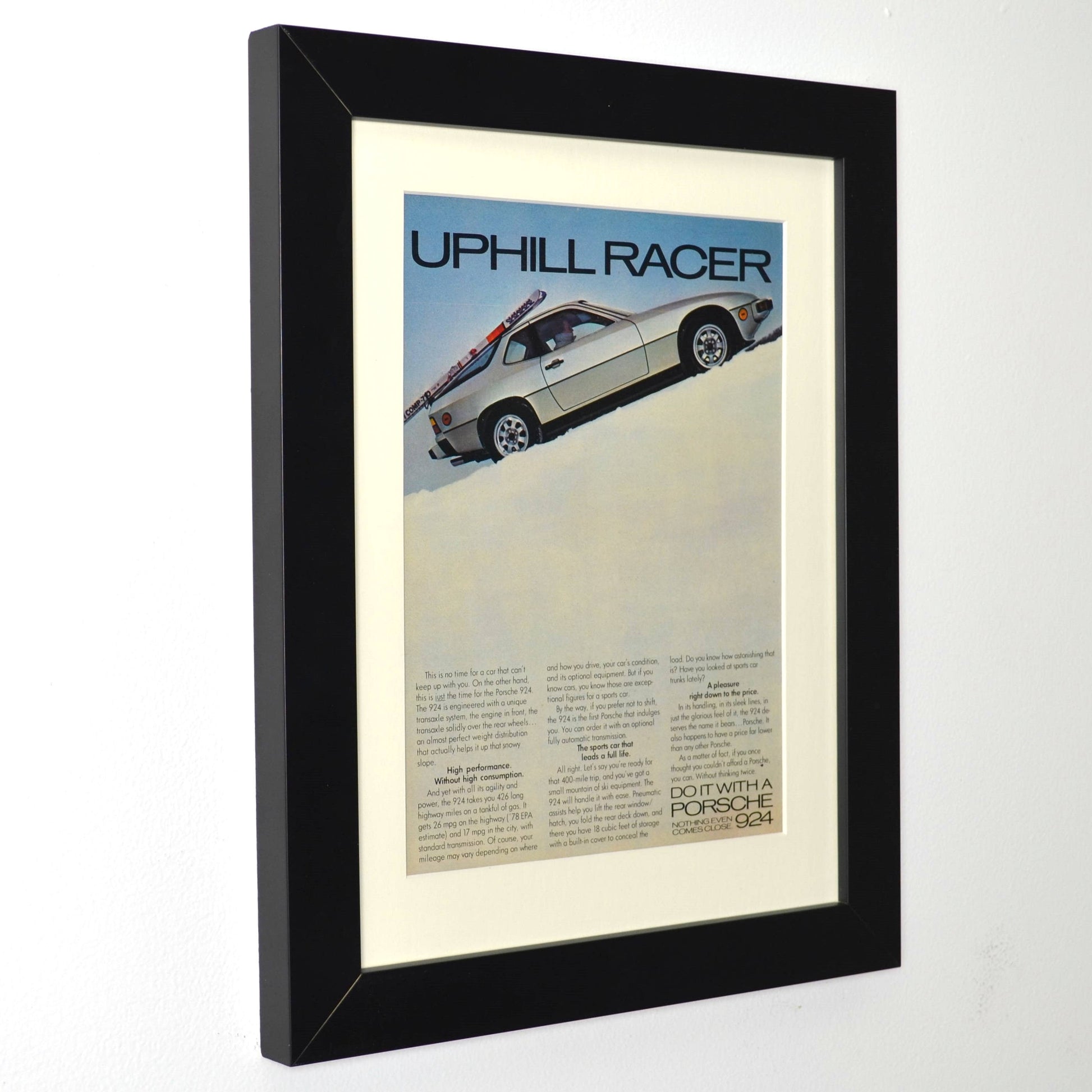Framed Vintage Porsche 924 Print – Classic ‘Uphill Racer’ Skiing Advertisement – Collector’s Wall Art side view