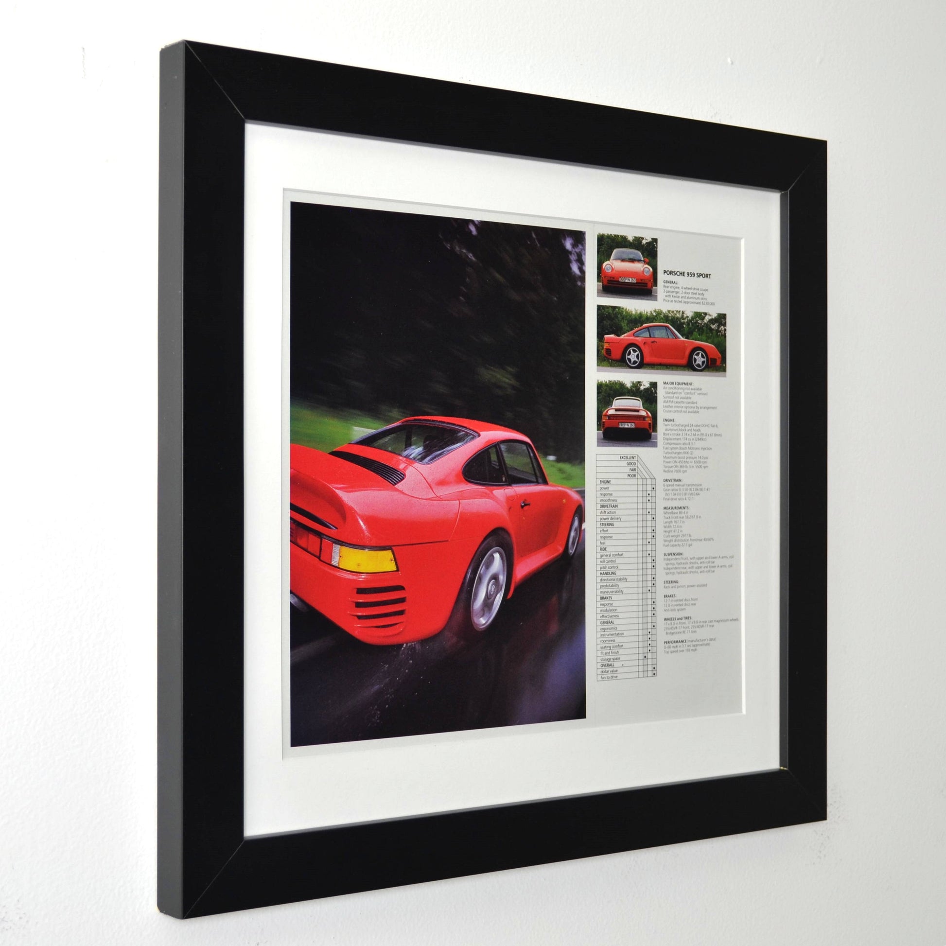 Framed vintage Red Porsche 959 Sport print ad, professionally dry mounted from two pages and displayed in a 13x14 matte black frame with white matting. Features the iconic Porsche 959 supercar in motion, along with performance specs and details side view